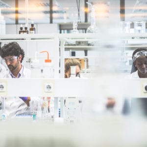 A group of scientists working in the laboratory