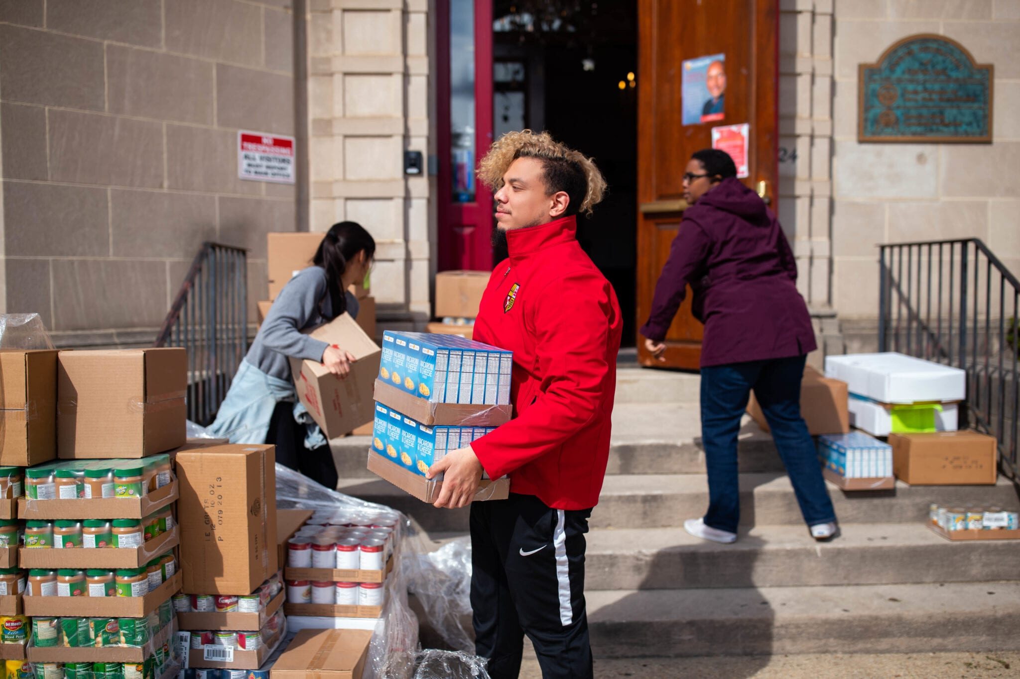 LAYC Career Academy unloads supplies from the food bank during COVID-19.