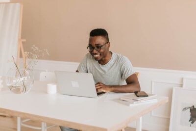 student at laptop doing work