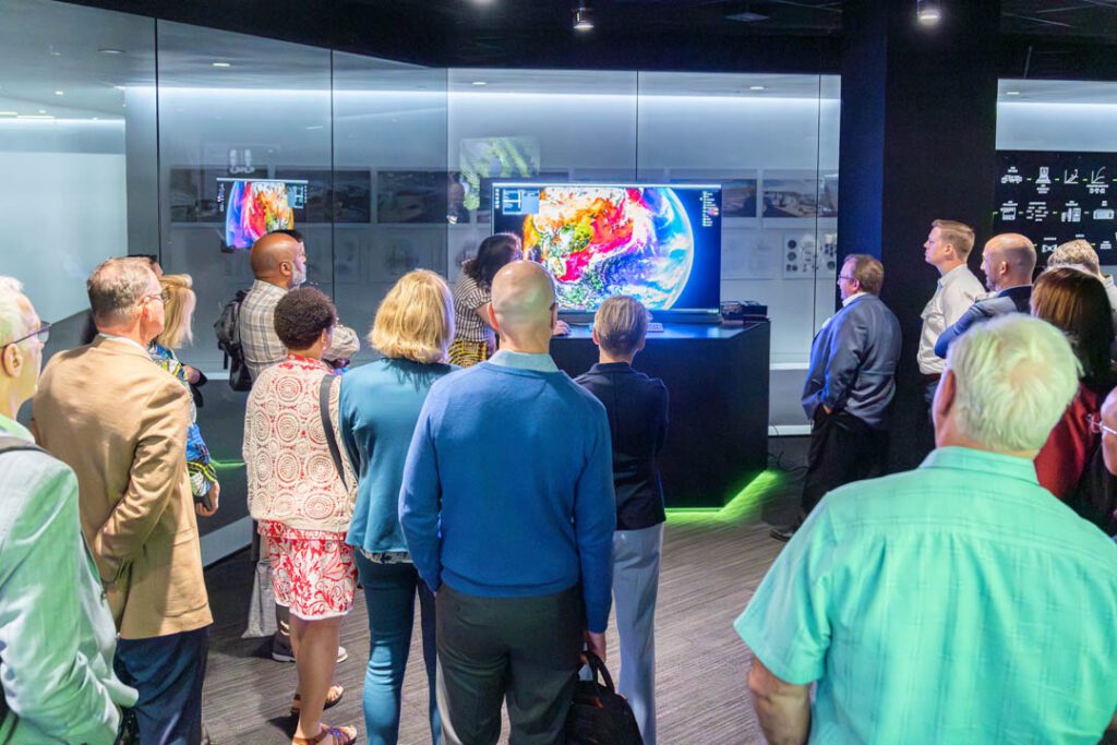 People looking at a screen at NVIDIA headquarters during the 2024 Presidential Experience Lab