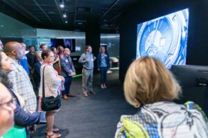 Tour group looking at screen during a presentation at NVIDIA